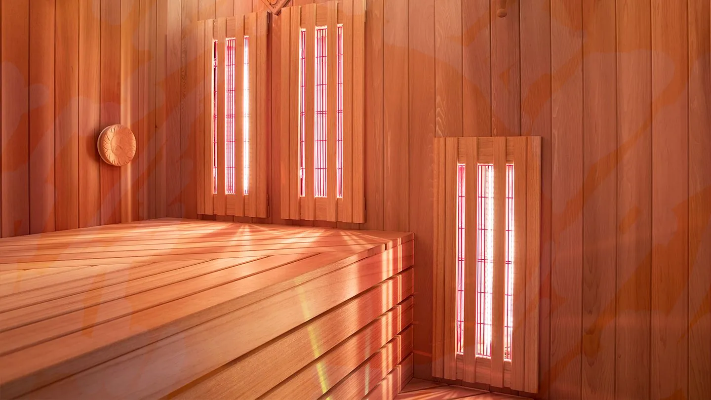 The cedar interior of the infrared sauna, its heaters glowing